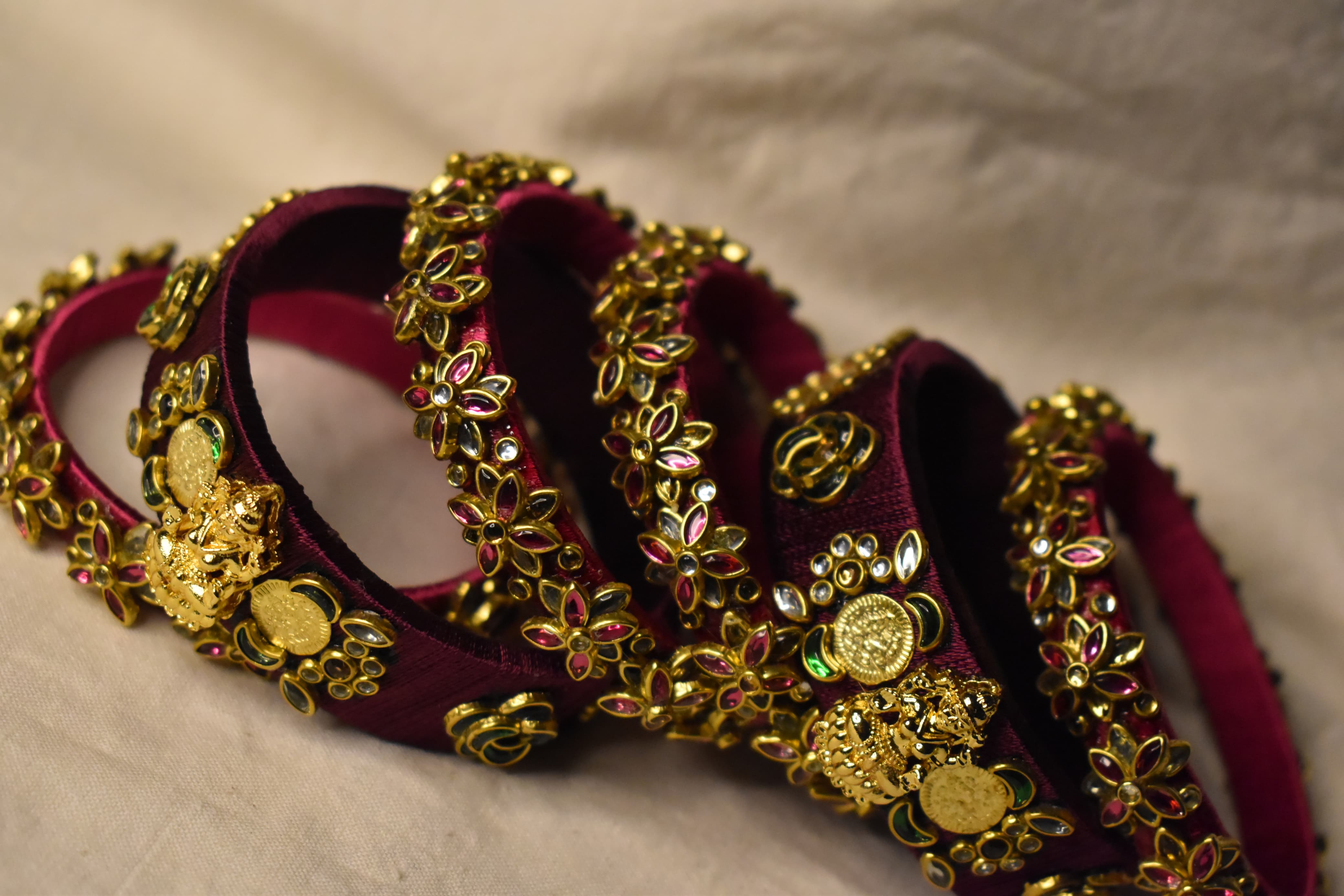 Maroon temple bridal handmade bangle set by Neevijas
